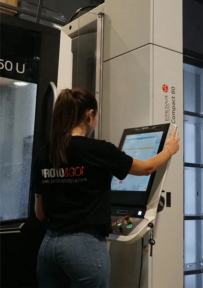 Technician operating a five-axis CNC machine